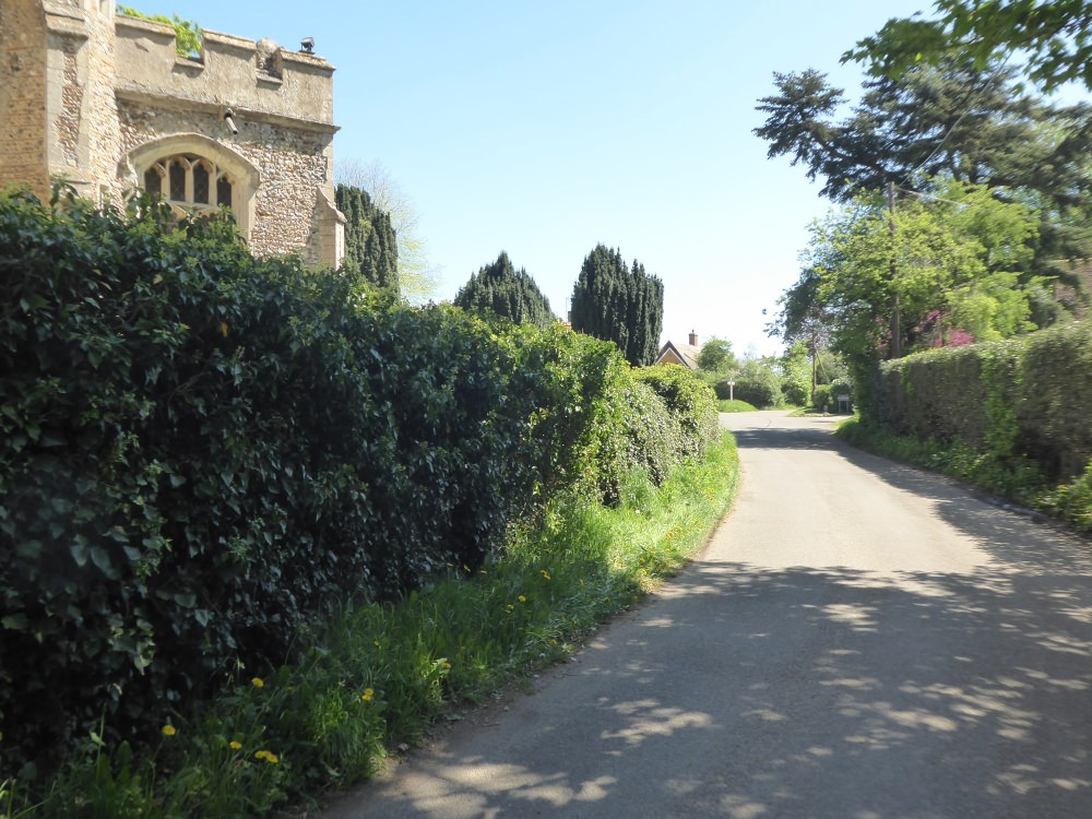 View of The Street round the church towards Upsher Green